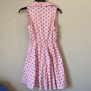 Pink and black polka dot dress.